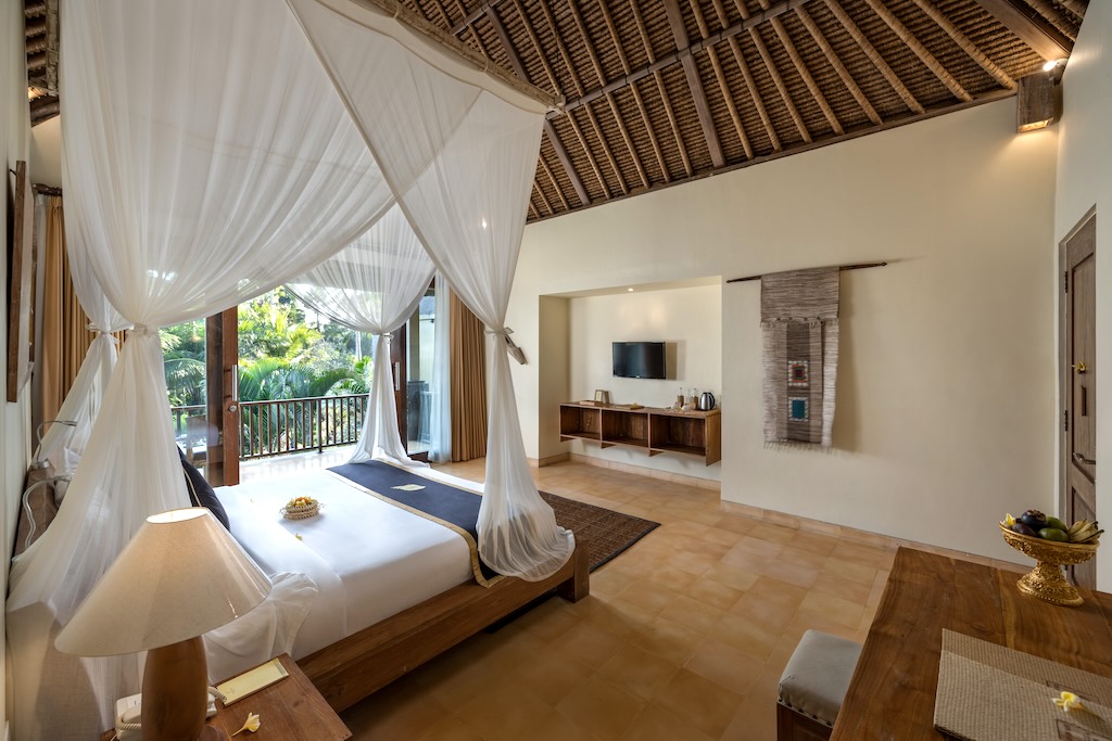 Double Bed of Deluxe Room at The Sankara Resort Ubud